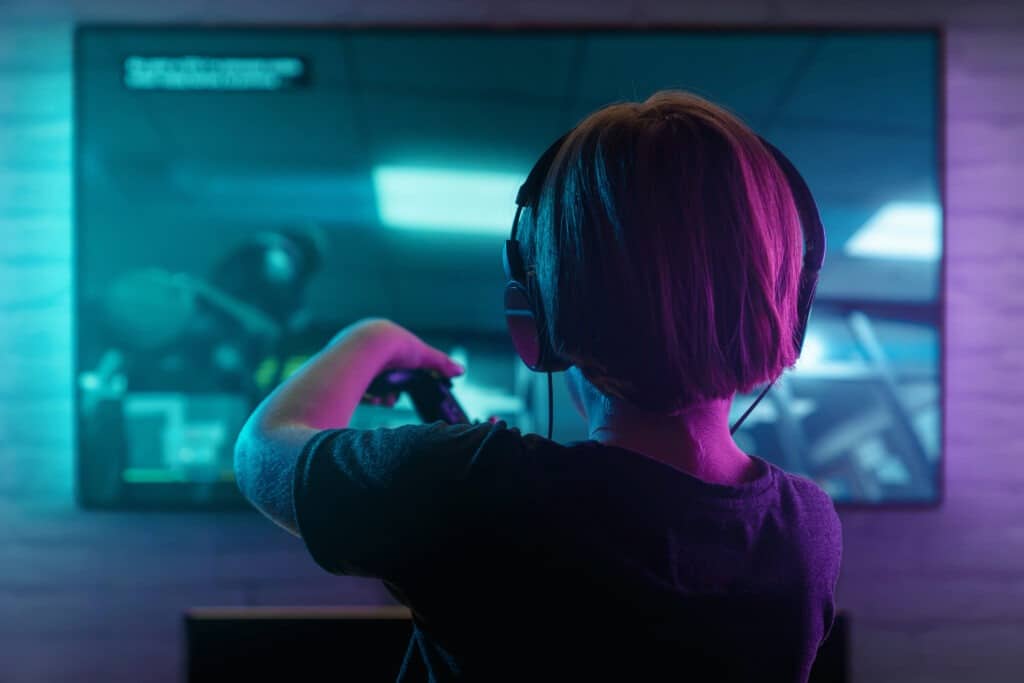 Illustration d'une personne vue de dos en train de jouer à un jeu vidéo